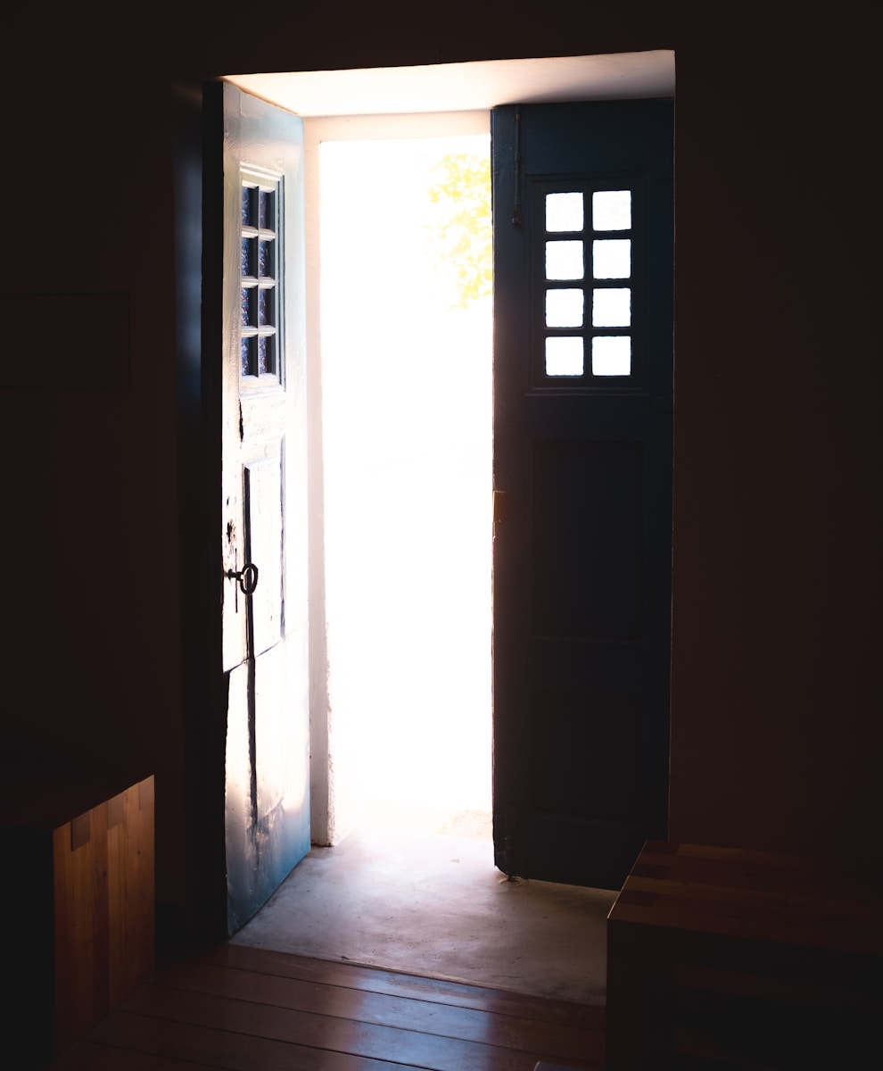 an open door leading into a dark room