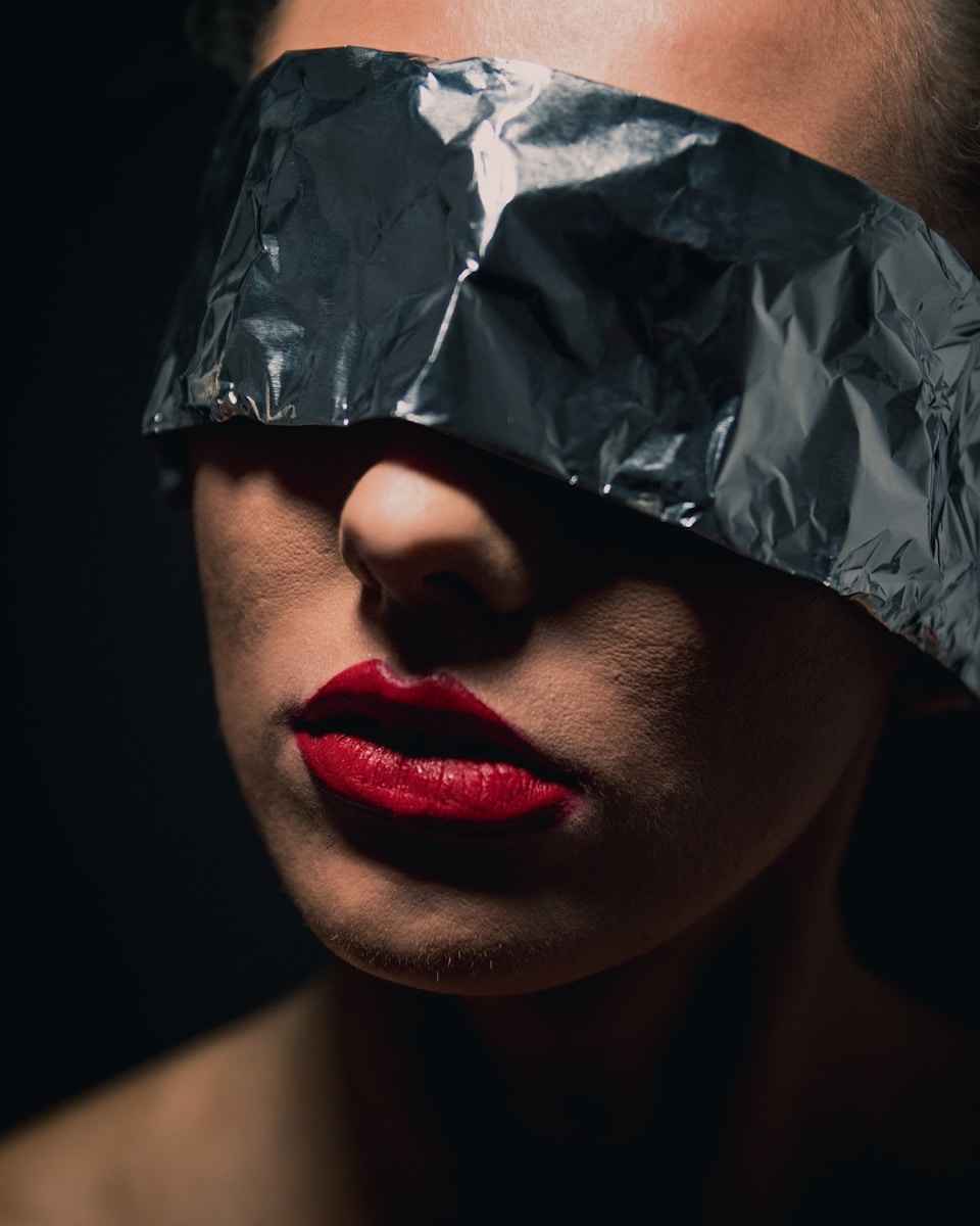 woman with red lipstick and silver diamond ring